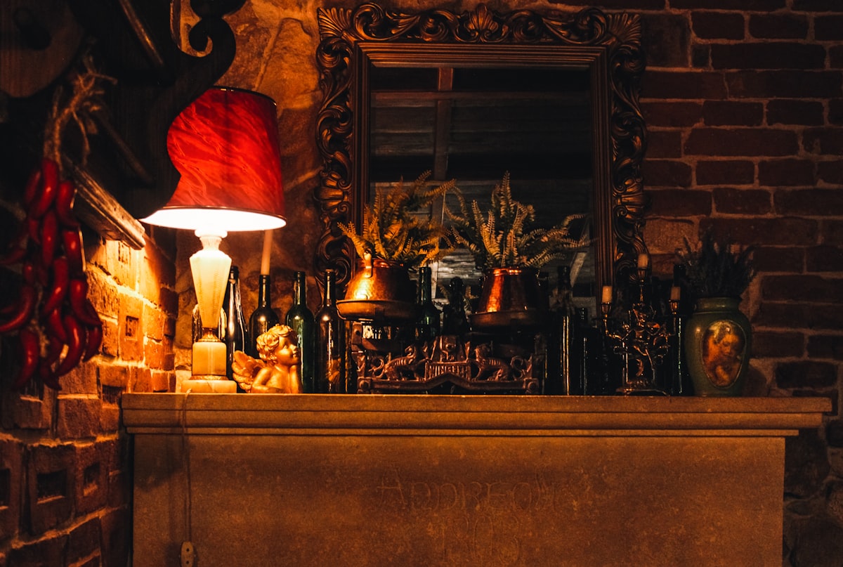 Close-up of a hand-forged iron candle sconce with visible hammer marks